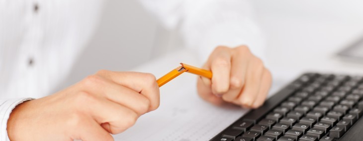 woman breaking pencil